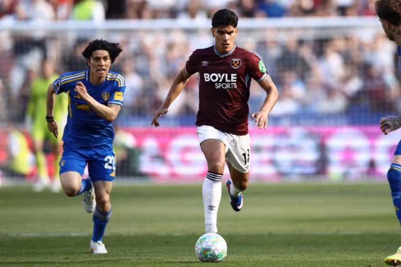 West Ham United's Portuguese midfielder #18 Mateus Fernandes runs with the ball during the English Premier League football match between West Ham United and Leeds United at the London Stadium, in east London on May 24, 2026. Henry NICHOLLS / AFP