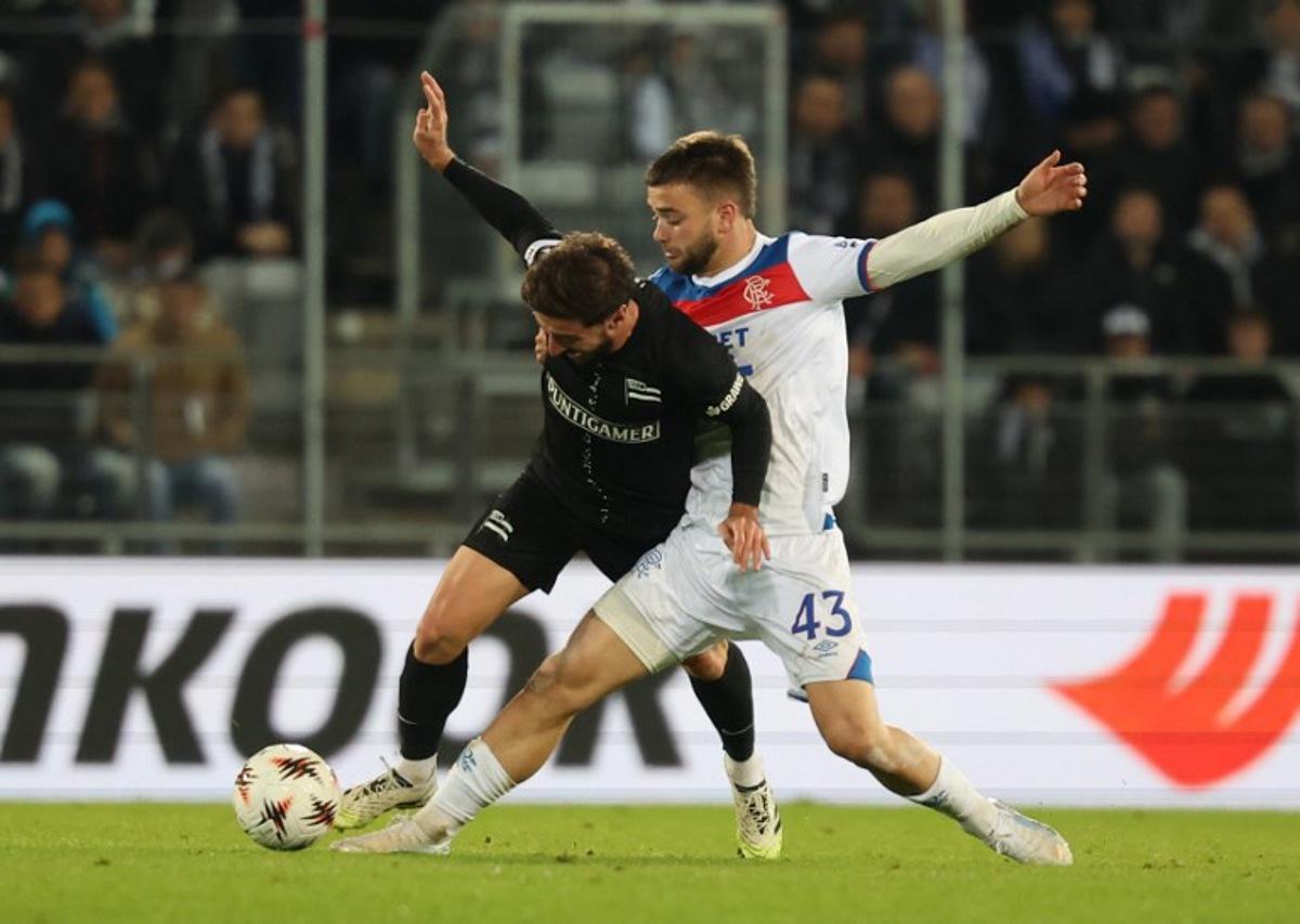 Sturm Graz's Georgian midfielder #10 Otar Kiteishvili and Glasgow Rangers' Belgian midfielder #43 Nicolas Raskin vie for the ball during the UEFA Europa League first round day 2 football match Sturm Graz v Glasgow Rangers in Graz, Austria, on October 2, 2025. ERWIN SCHERIAU / APA / AFP