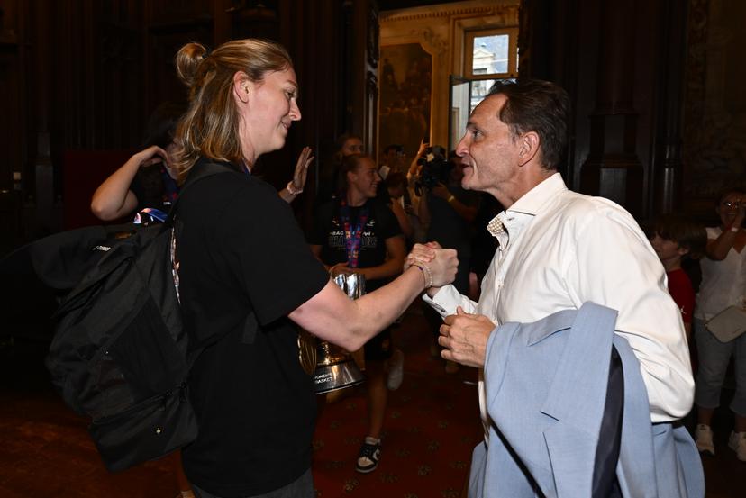 Jean-Michel Saive (R) congratulates Belgium's Emma Meesseman at the celebrations at the Brussels city hall and Grand Place/ Grote Markt for Belgian national women basket team 'the Belgian Cats', after winning yesterday's European Championship final, Monday 30 June 2025. Yesterday the Cats successfully defended their European title, beating Spain in the final of the FIBA Women's EuroBasket 2025. BELGA PHOTO ERIC LALMAND