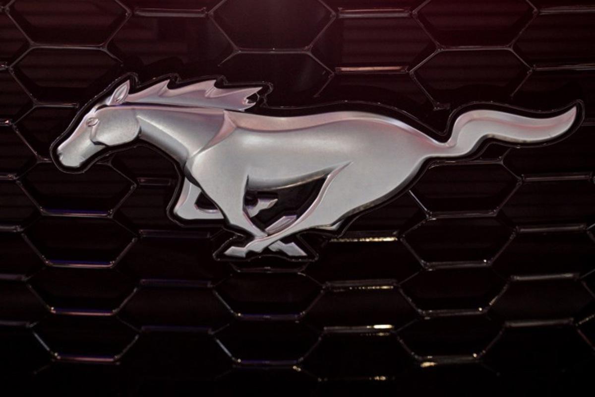 A Ford Mustang logo on is seen during the 21st Shanghai International Automobile Industry Exhibition at the National Exhibition and Convention Center in Shanghai on April 24, 2025. Hector RETAMAL / AFP