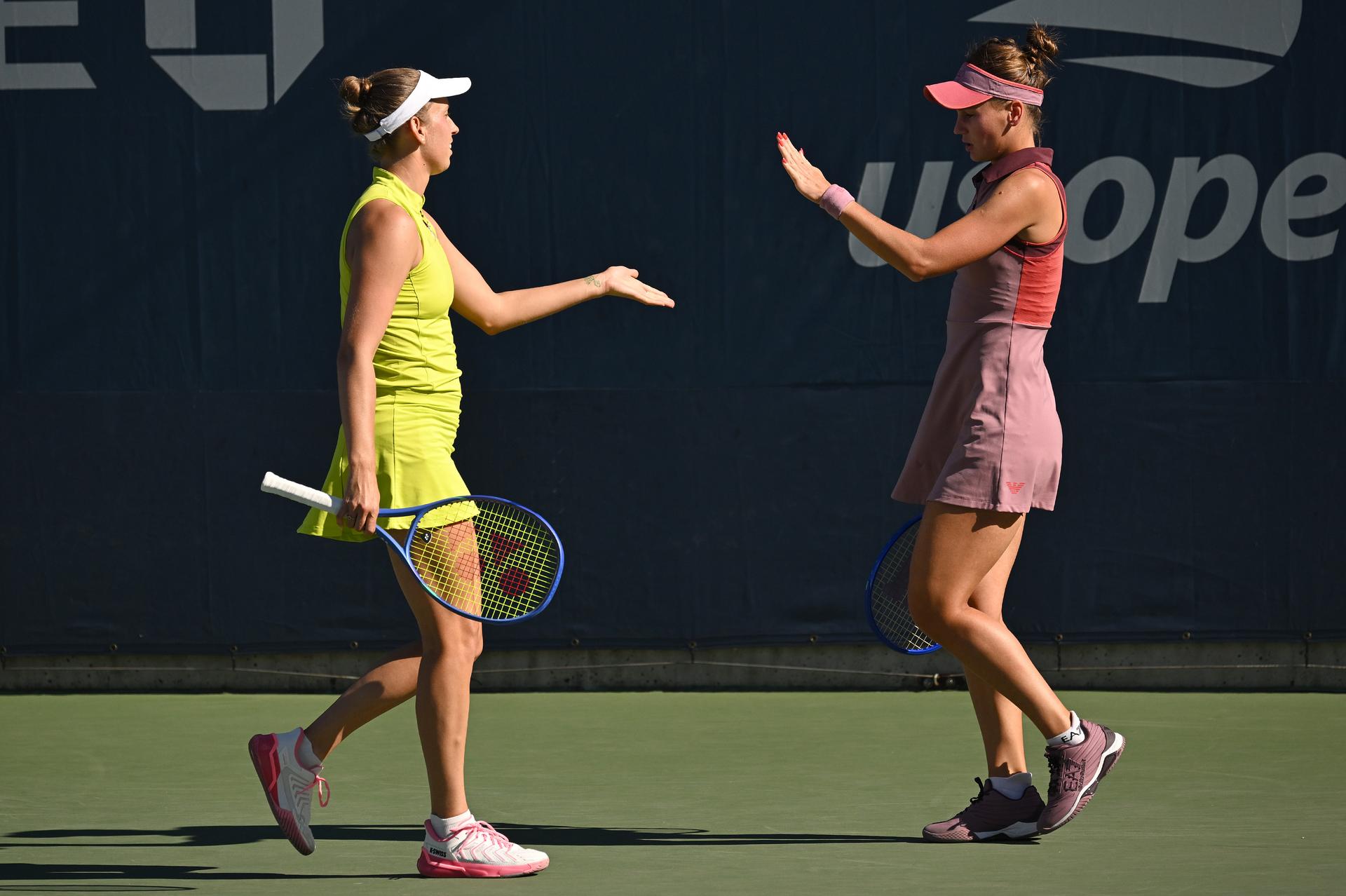 Belgian Elise Mertens (yellow) and Veronika Kudermetova (pink) pictured during a tennis match against US pair Brantmeier-Hamilton, in the second round of the women's doubles of the 2025 US Open Grand Slam tennis tournament in New York City, USA, Saturday 30 August 2025. BELGA PHOTO TONY BEHAR