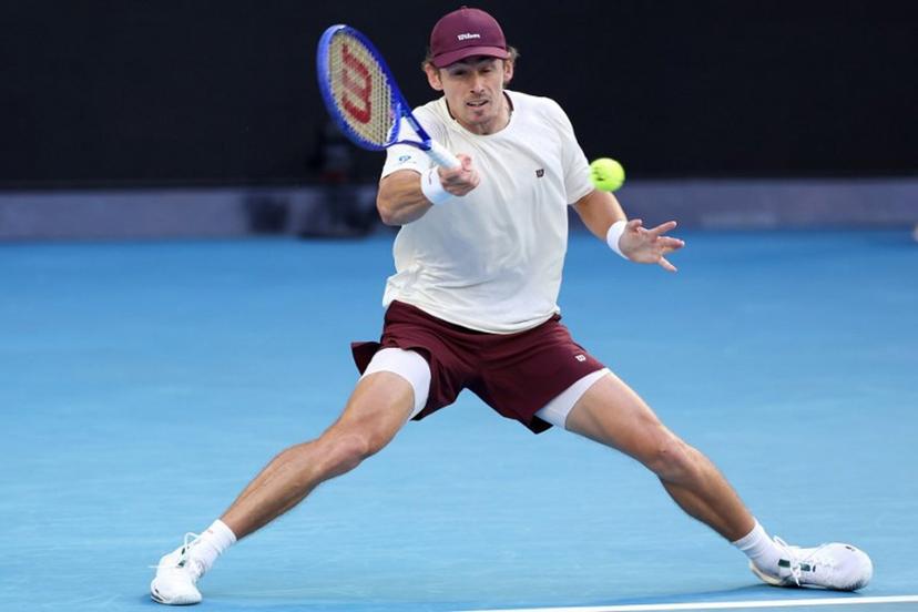 Australia's Alex De Minaur hits a return to Kazakhstan's Alexander Bublik during their men's singles match on day eight of the Australian Open tennis tournament in Melbourne on January 25, 2026. Martin KEEP / AFP