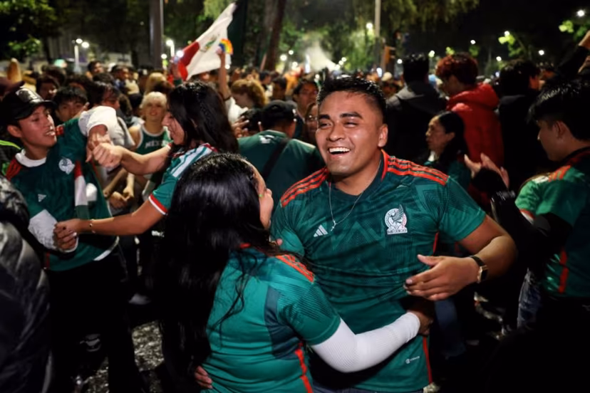 Mexican football fans celebrate their victory at the Angel de la Independencia in Mexico City on June 24, 2026, after the 2026 FIFA World Cup football match between Mexico and Czechia. Claudia Rosel / AFP