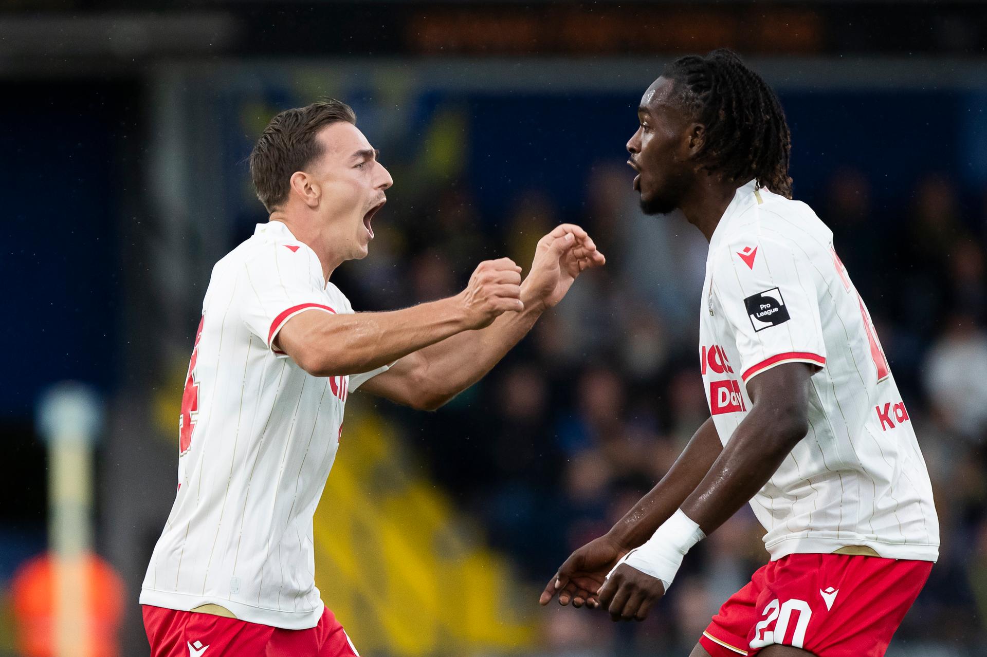 Standard's Casper Nielsen and Standard's Ibrahim Karamoko celebrate during a soccer match between KVC Westerlo and Standard de Liege, Sunday 21 September 2025 in Westerlo, on day 8 of the 2025-2026 'Jupiler Pro League' first division of the Belgian championship. BELGA PHOTO KRISTOF VAN ACCOM