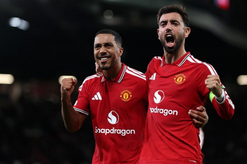 Manchester United's Portuguese midfielder #08 Bruno Fernandes celebrates scoring the team's second goal with Manchester United's Belgian midfielder #18 Youri Tielemans (L) during the UEFA Champions League football match between Manchester United and Sabah FK at Old Trafford in Manchester, north west England, on September 10, 2026. Darren Staples / AFP
