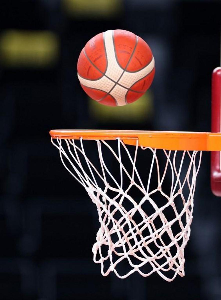 An Olympic basketball drops through a net during Spain's basketball team training session at the Saitama Super Arena in Saitama on July 23, 2021, ahead of the Tokyo 2020 Olympic Games. Thomas COEX / AFP