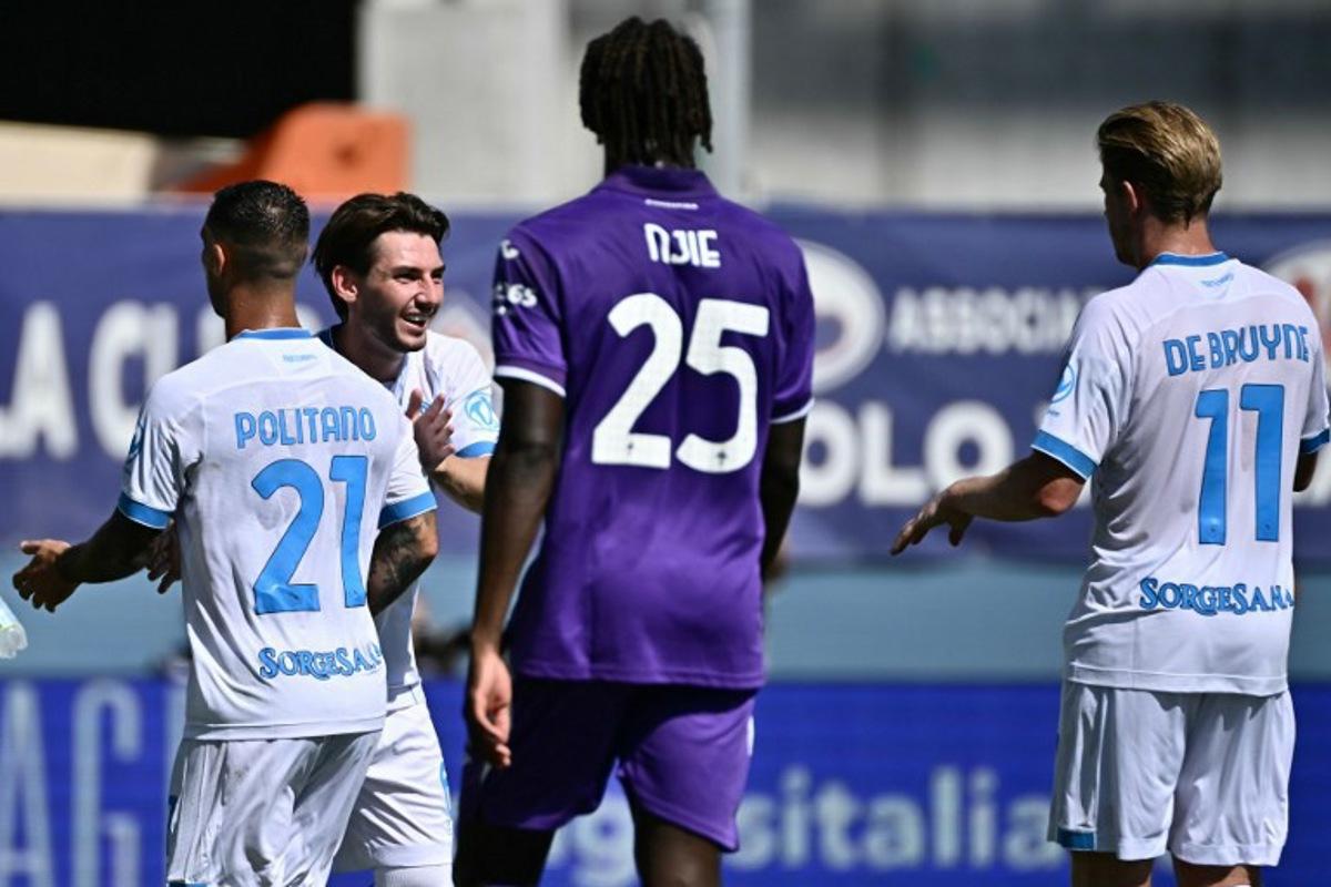 Napoli's Scottish midfielder #06 Billy Gilmour celebrates with teammates after scoring the opening goal during the Italian Serie A football match between Fiorentina and SSC Napoli at the Artemio Franchi stadium in Florence, on September 20, 2026. Filippo MONTEFORTE / AFP