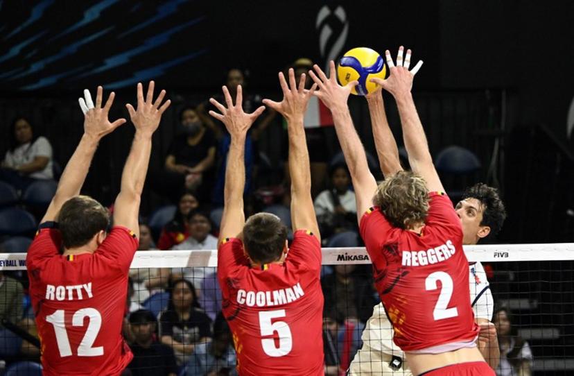 In this photo taken on April 16, 2025, Italy's Simone Anzani (R) spikes the ball against Belgium's Seppte Rotty (L), Pieter Coolman (C) and Ferre Reggers (R) at the World Men's Volleyball Championship in Manila. Ted ALJIBE / AFP
