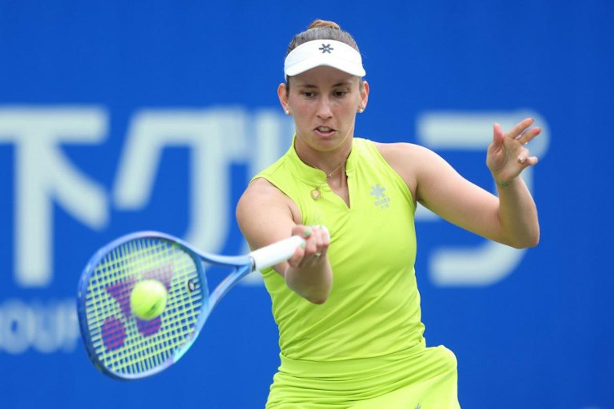 Belgium's Elise Mertens hits a return against Czech Republic's Tereza Valentova during their women's singles match at the Japan Open tennis tournament in Osaka on October 16, 2025. PAUL MILLER / AFP