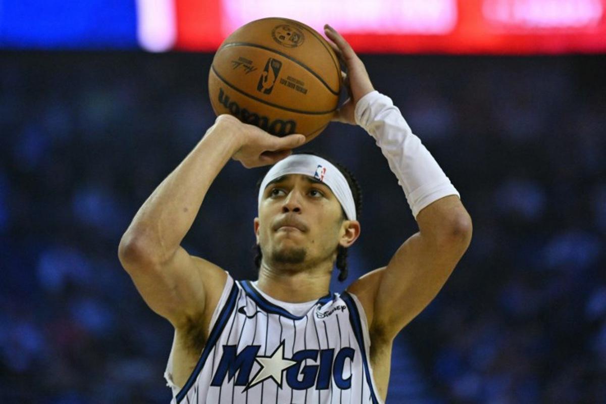 Orlando Magic's US point guard #00 Anthony Black takes a free throw during the 2025/2026 NBA season basketball match between the Memphis Grizzlies and Orlando Magic at the O2 Arena in London on January 18, 2026. Glyn KIRK / AFP
