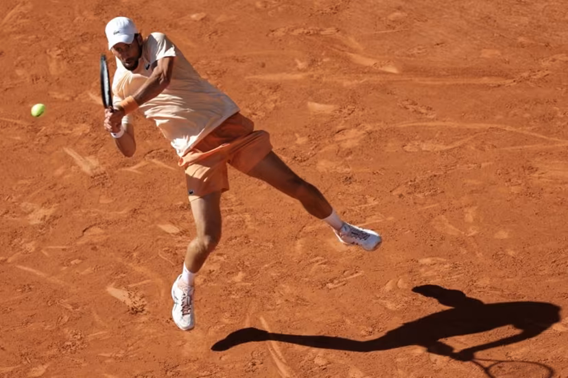 Serbia's Novak Djokovic plays a backhand return to France's Valentin Royer during their men's singles match on day 4 of the French Open tennis tournament on Court Philippe-Chatrier at the Roland-Garros Complex in Paris on May 27, 2026. Thomas SAMSON / AFP