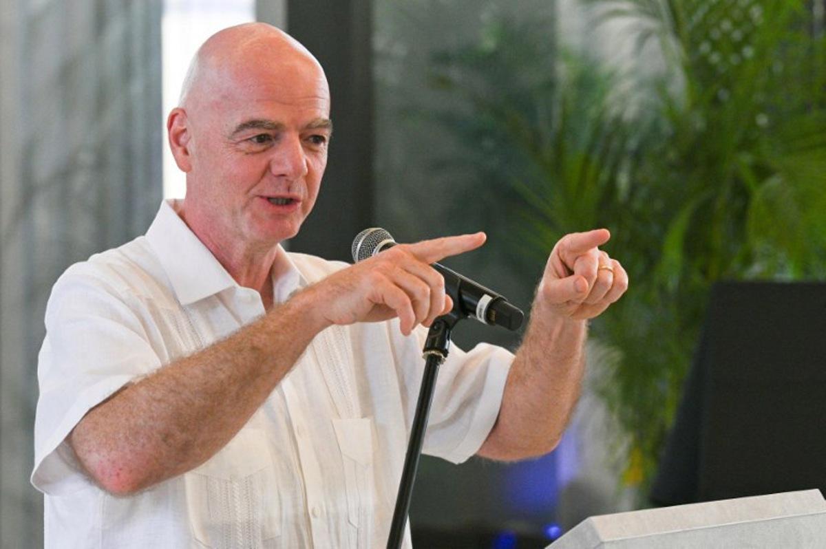 FIFA President Gianni Infantino gestures as he speaks during his visit to the new Concentration Hotel of the Colombian Football Federation in Barranquilla, Colombia, on February 24, 2026. FIFA boss Gianni Infantino told AFP on February 24, 2026, he was "very reassured" about Mexico's hosting of games in the World Cup, in his first comments on the violence triggered by the killing of a drug cartel leader. David SALAZAR / AFP