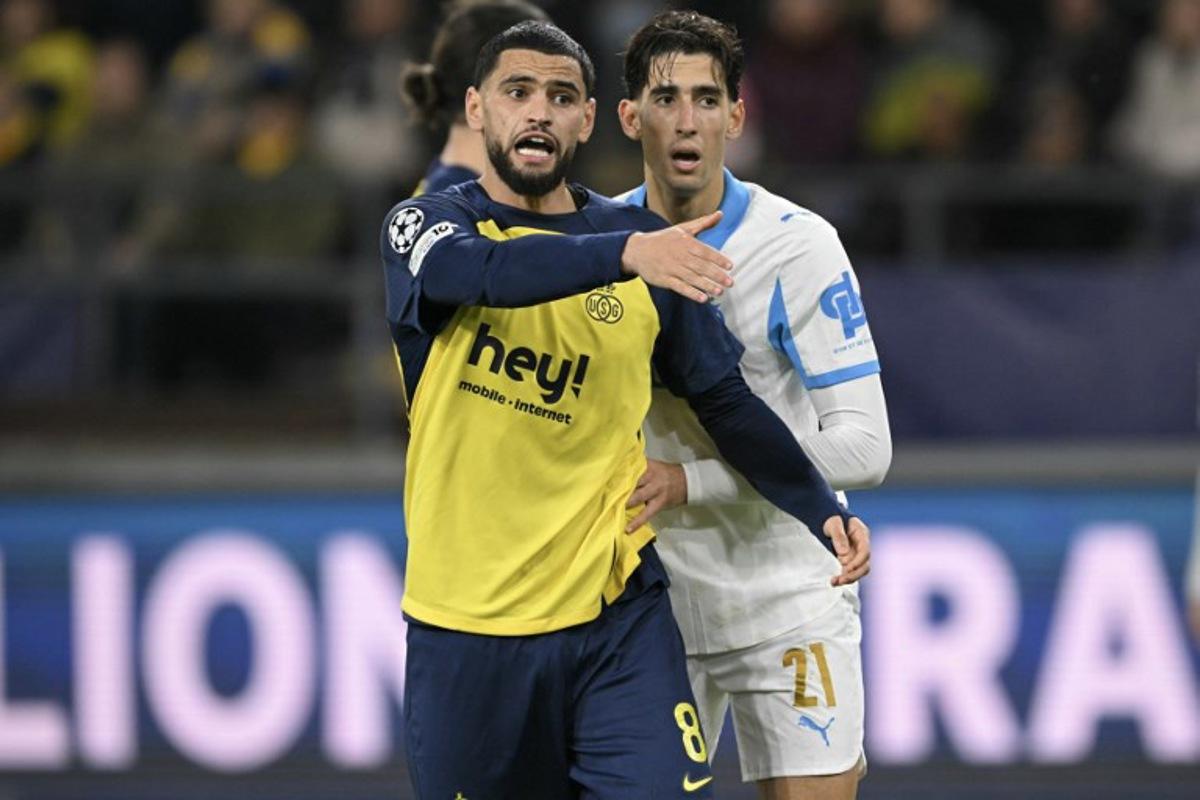 Union St-Gilloise's Algerian midfielder #08 Adem Zorgane reacts during the UEFA Champions League, league phase day 6, football match between Royale Union Saint-Gilloise (BEL) and Olympique de Marseille (FRA), at the RSC Anderlecht Stadium in Brussels, on December 9, 2025. NICOLAS TUCAT / AFP