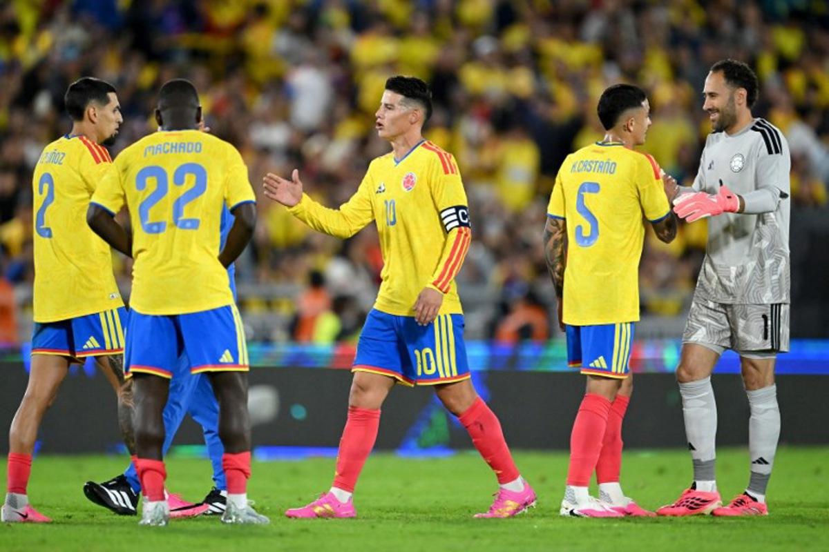 Colombia's midfielder #10 James Rodriguez (C) shakes hands with teammates after winning the international friendly football match between Colombia and Costa Rica at the Nemesio Camacho El Campin stadium in Bogota on June 1, 2026. Raul ARBOLEDA / AFP