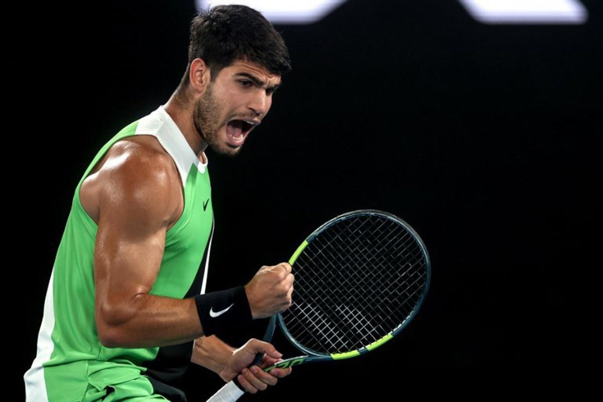 Spain's Carlos Alcaraz reacts after a point against Australia's Alex De Minaur during their men's singles quarter-final match on day ten of the Australian Open tennis tournament in Melbourne on January 27, 2026. IZHAR KHAN / AFP