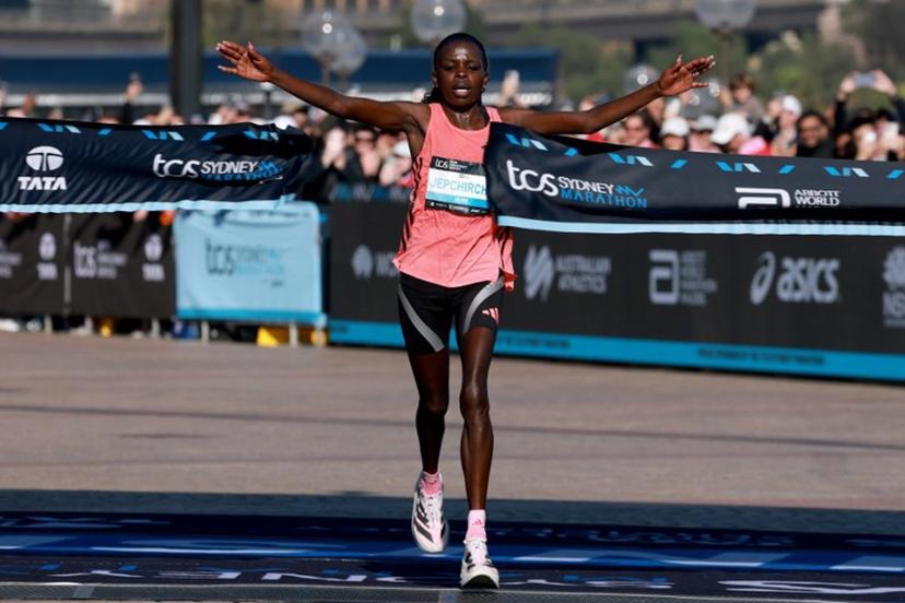 Kenya's Peres Jepchirchir celebrates as she crosses the finish line to win the Women's section of the 2026 Sydney Marathon in Sydney on August 30, 2026. DAVID GRAY / AFP