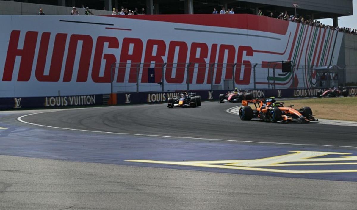 McLaren's British driver Lando Norris competes ahead of Red Bull Racing's Dutch driver Max Verstappen, Ferrari's British driver Lewis Hamilton, and Ferrari's Monegasque driver Charles Leclerc during the Formula One Hungarian Grand Prix at the Hungaroring racetrack in Mogyorod near Budapest, Hungary, on July 26, 2026. Andrej ISAKOVIC / AFP