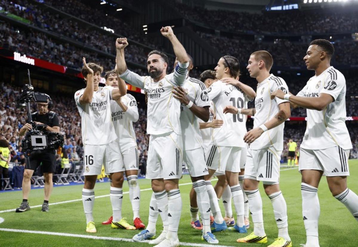 Real Madrid's Spanish defender #02 Dani Carvajal celebrates Real Madrid's Spanish forward #16 Gonzalo Garcia's goal during the Spanish league football match between Real Madrid CF and Athletic Club Bilbao at Santiago Bernabeu Stadium in Madrid on May 23, 2026. Pierre-Philippe MARCOU / AFP