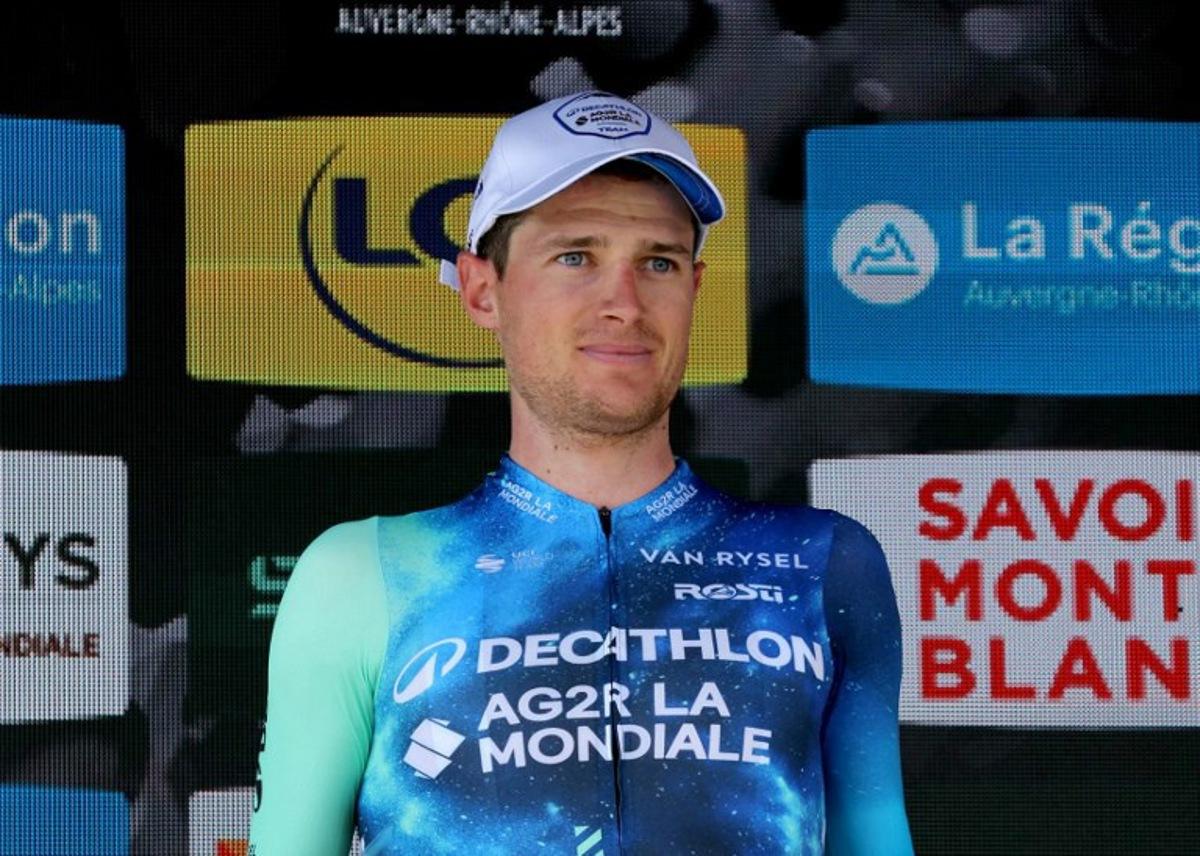 Team AG2R's French rider Nicolas Prodhomme celebrates on the podium after winning the day's most combative rider award of the third stage of the 76th edition of the Criterium du Dauphine cycling race, 181,7km between Celles-sur-Durolle and Les Estables, central France, on June 4, 2024. Thomas SAMSON / AFP