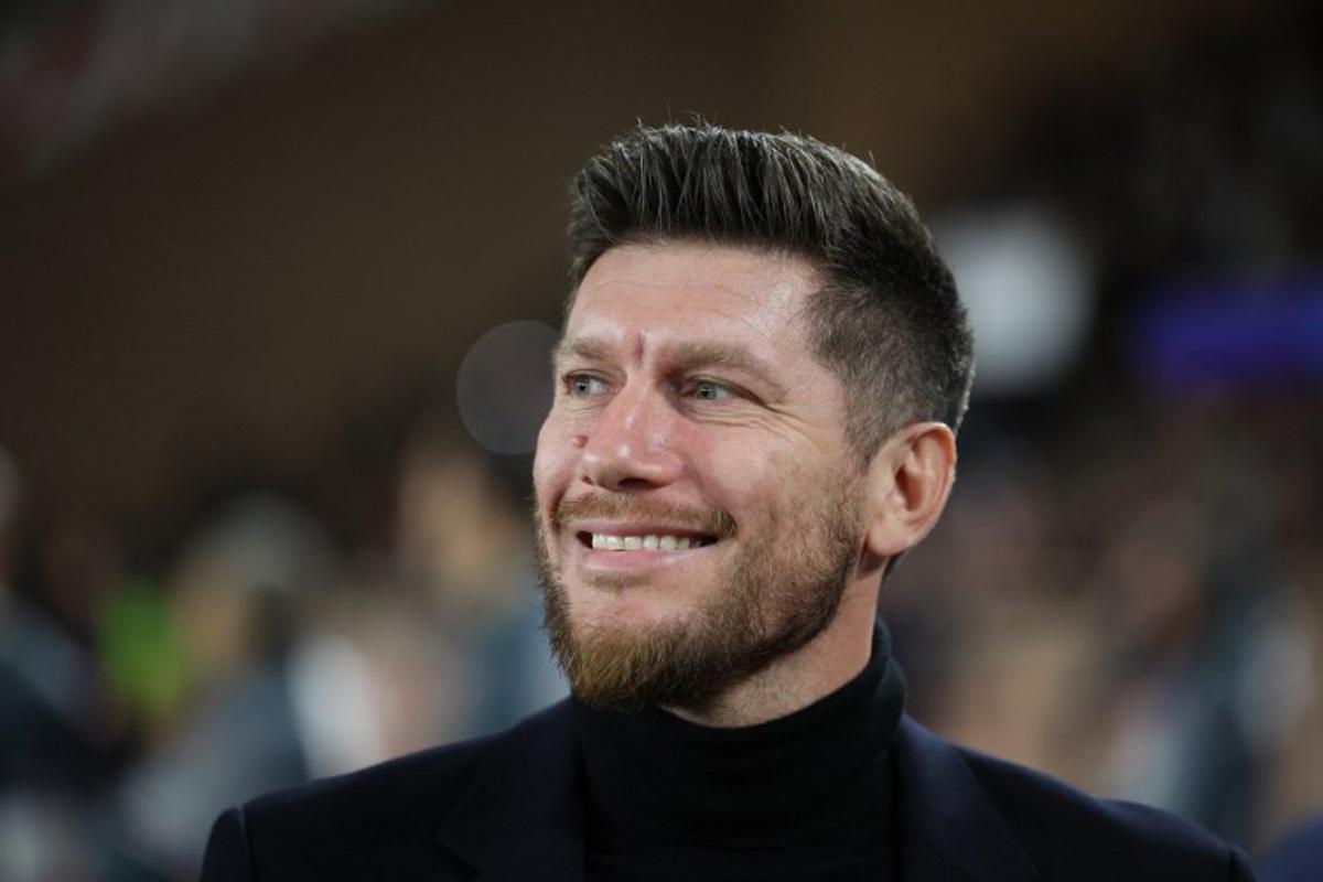 Monaco's Belgian head coach Sebastien Pocognoli looks on before the start of the UEFA Champions League knockout round play-off first leg football match between AS Monaco and Paris Saint-Germain at Stade Louis II in the Principality of Monaco on February 17, 2026. Valery HACHE / AFP