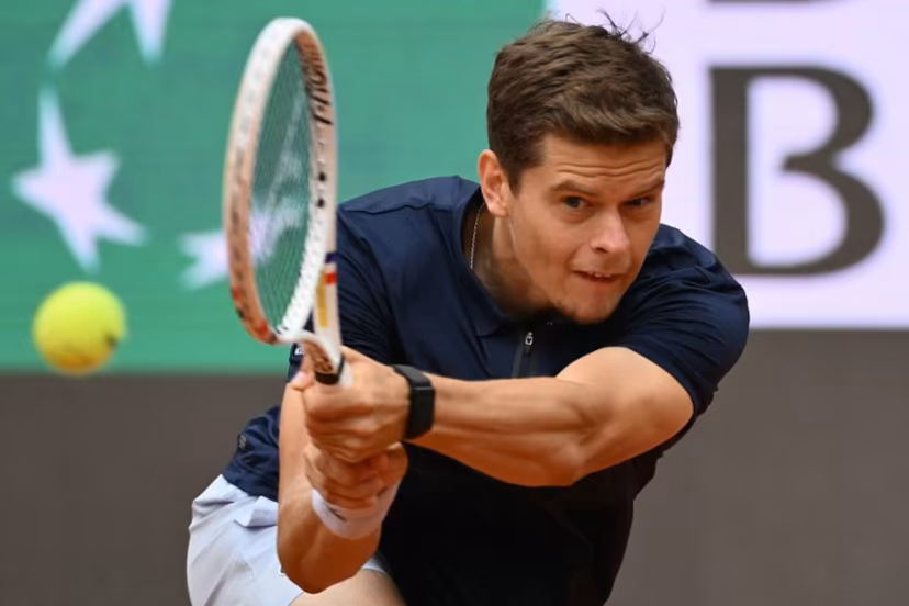 Belgium's Alexander Blockx hits a return to Germany's Alexander Zverev during their men's singles match at the ATP Rome Open tennis tournament at Foro Italico in Rome on May 10, 2026. Alberto PIZZOLI / AFP