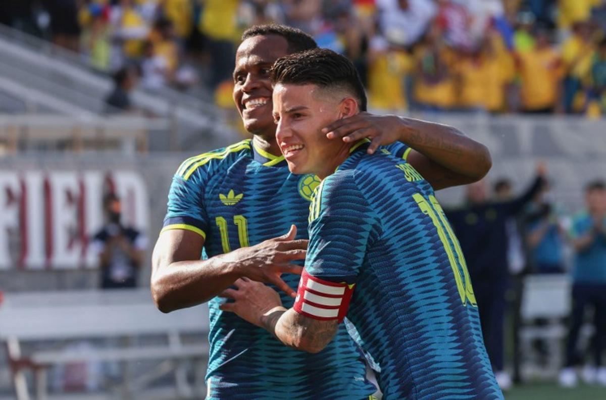 Colombia's midfielder #11 Jhon Arias celebrates with Colombia's midfielder #10 James Rodriguez after scoring a goal during the international friendly football match between Colombia and Jordan at Snapdragon Stadium in San Diego, California, on June 7, 2026. SANDY HUFFAKER / AFP