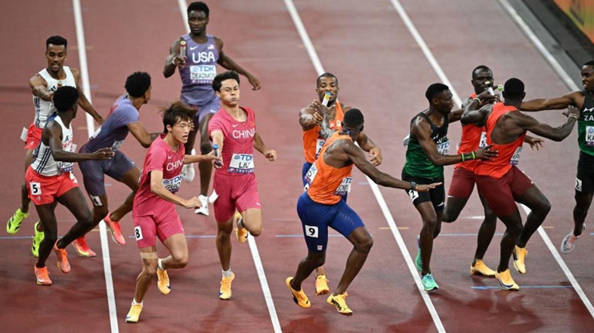 Athletes including France's David Sombe, France's athlete Yann Spillmann, US' Bryce Deadmon, China's athlete Guo Longyu, China's athlete Liu Kai, Netherlands' Ramsey Angela and Netherlands' athlete Liemarvin Bonevacia compete in the men's 4x400m relay heats during the World Athletics Championships in Tokyo on September 20, 2025. Philip FONG / AFP