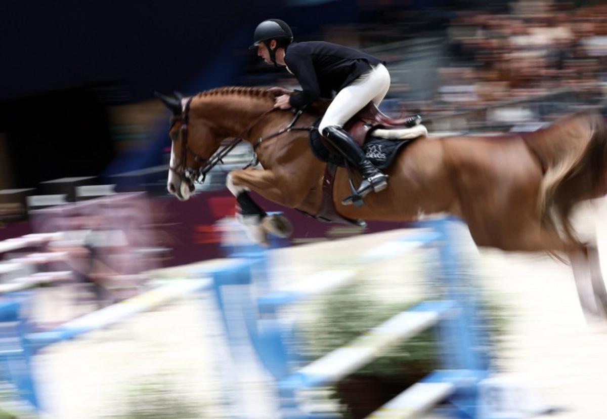 Belgium's Pieter Devos riding Jade V Bisschop competes during the "Le Saut Hermes CSI 5*" International Jumping Competition at the Grand Palais Ephemere in Paris, on March 16, 2024. FRANCK FIFE / AFP