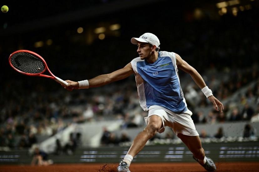 Italy's Matteo Arnaldi plays a backhand return to Italy's Matteo Berrettini during their men's quarter final singles match on day 11 of the French Open tennis tournament on Court Philippe-Chatrier at the Roland-Garros Complex in Paris on June 3, 2026. JULIEN DE ROSA / AFP
