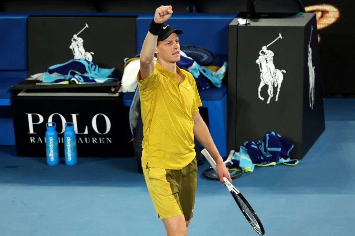 Italy's Jannik Sinner celebrates victory over USA's Eliot Spizzirri after their men's singles match on day seven of the Australian Open tennis tournament in Melbourne on January 24, 2026. Martin KEEP / AFP