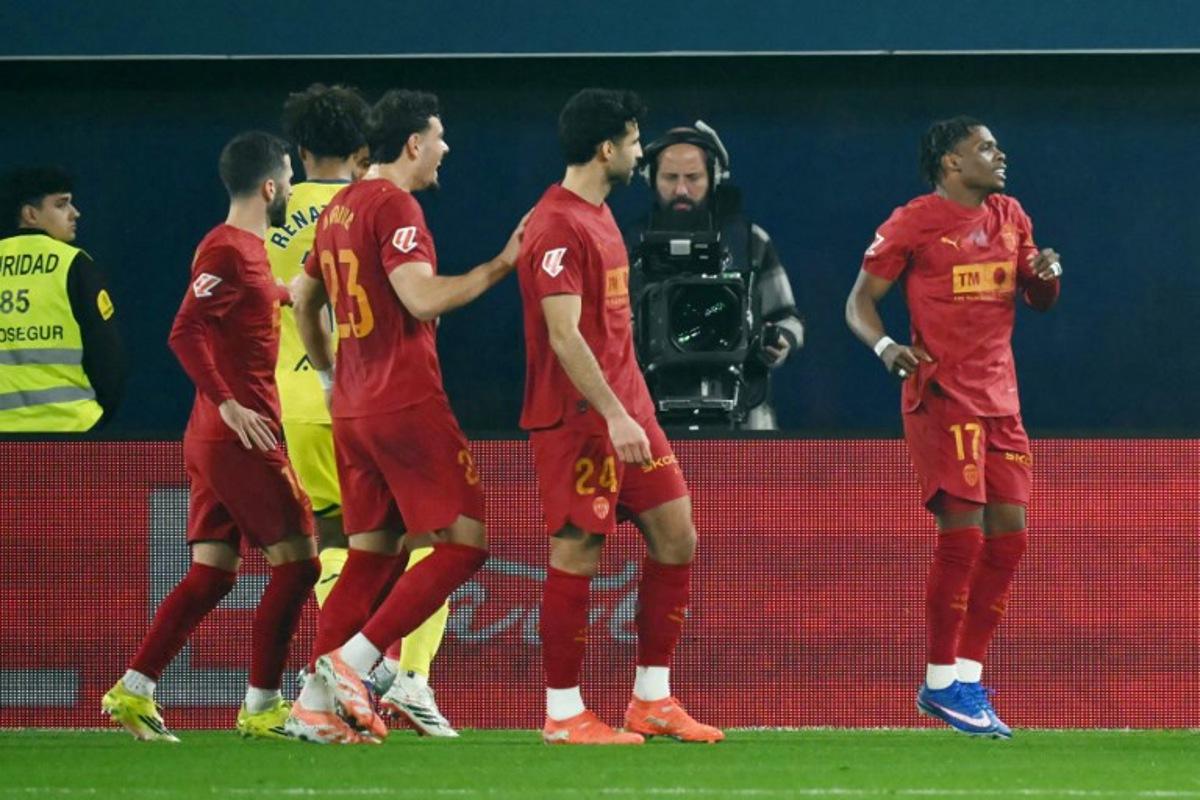 Valencia's Belgian forward # 17 Largie Ramazani celebrates after scoring the opening goal from the penalty spot during the Spanish league football match between Villarreal CF and Valencia CF at La Ceramica Stadium in Vila-real on February 22, 2026. JOSE JORDAN / AFP