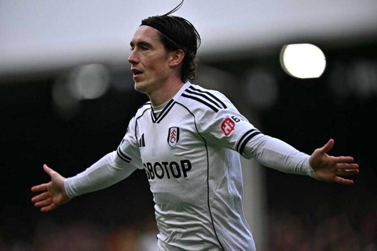 Fulham's Welsh midfielder #08 Harry Wilson celebrates after scoring the opening goal during the English Premier League football match between Fulham and Tottenham Hotspur at Craven Cottage in London on March 1, 2026. Ben STANSALL / AFP