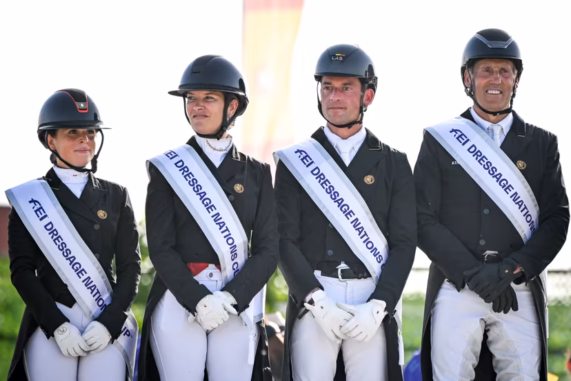Belgian Charlotte Defalque, Belgian Larissa Pauluis, Belgian Justin Verboomen and Belgian Wim Verwimp pictured during the podium ceremony after the Dressage Nations Cup FEI CDIO4 equestrian event in Koningshooikt, Lier on Saturday 23 May 2026. BELGA PHOTO ELIAS ROM