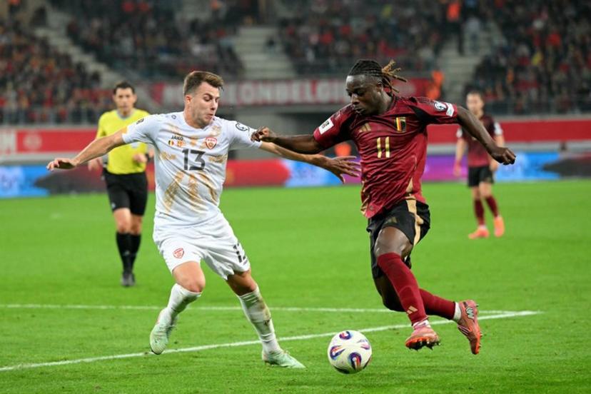 North Macedonia's defender #13 Stefan Despotovski (L) fights for the ball with Belgium's forward #11 Jeremy Doku during the FIFA World Cup 2026 Group J European qualification football match between Belgium and North Macedonia at the Planet Group Arena in Ghent, on October 10, 2025. NICOLAS TUCAT / AFP