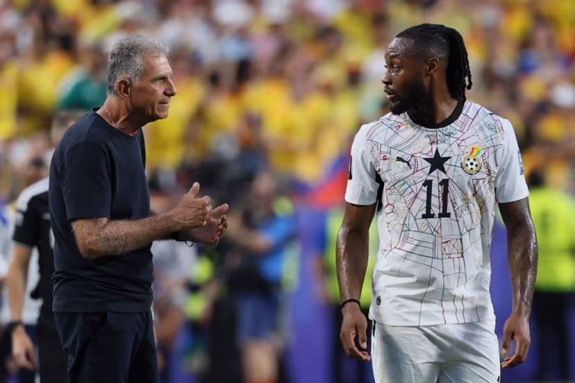 Ghana's Portuguese head coach Carlos Queiroz speaks with Ghana's forward #11 Antoine Semenyo during the 2026 World Cup round of 32 football match between Colombia and Ghana at the Kansas City Stadium in Kansas City on July 3, 2026. Odd ANDERSEN / AFP