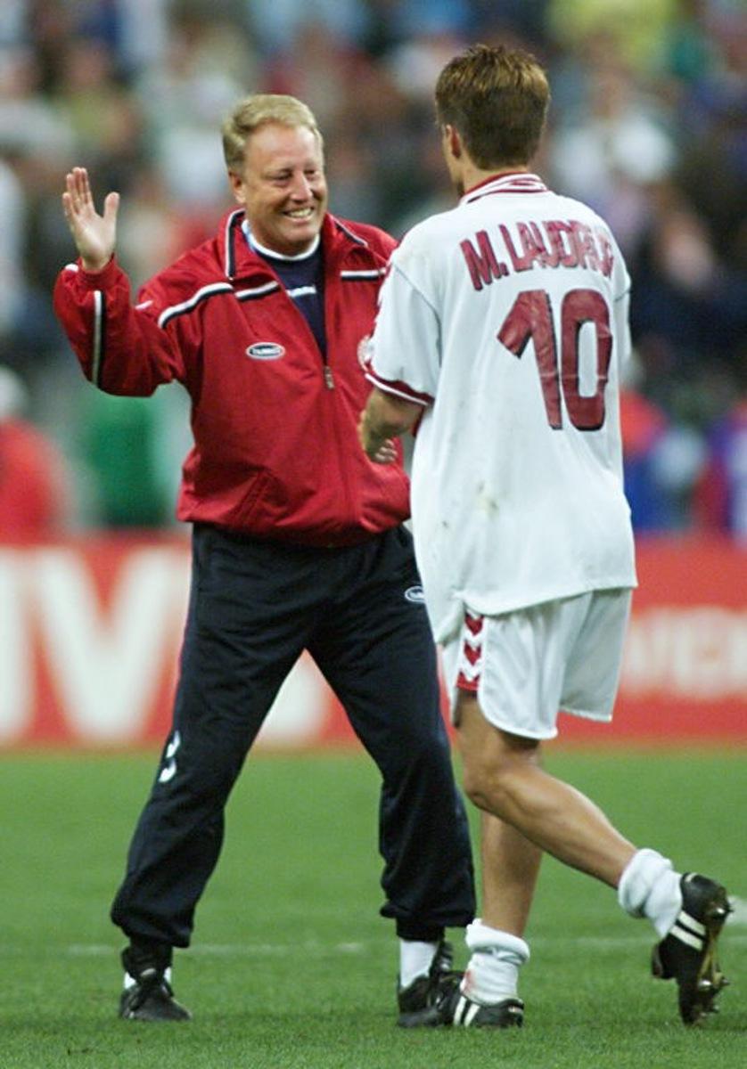 Danish coach Bo Johansson (L) congratulates his team's captain Michael Laudrup, 28 June at the Stade de France in Saint-Denis, after their 1998 Soccer World Cup second round match against Nigeria. Denmark won 4-1 and qualified for the quarterfinal. (ELECTRONIC IMAGE) AFP PHOTO Toshifumi KITAMURA / AFP