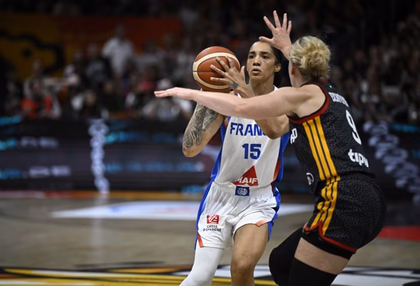 France's forward #15 Gabby Williams (L) and Germany's small forward #09 Emma Eichmeyer vie for the ball during the 2026 FIBA Women's Basketball World Cup semi-final match between France and Germany in Berlin on September 12, 2026. Tobias SCHWARZ / AFP