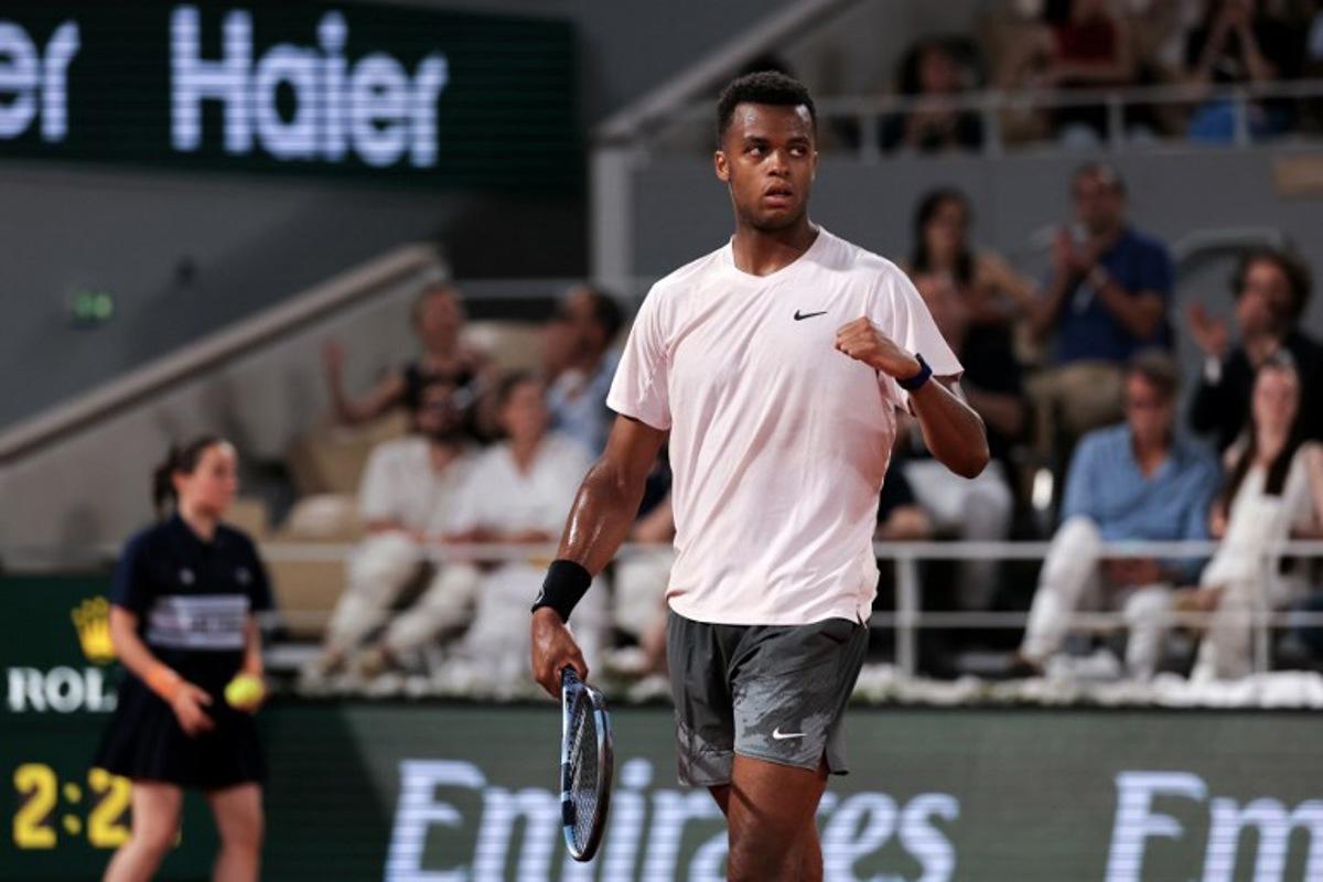 France's Giovanni Mpetshi Perricard reacts after a point as he plays against Serbia's Novak Djokovic during their men's singles match on day 1 of the French Open tennis tournament on Court Philippe-Chatrier at the Roland-Garros Complex in Paris on May 24, 2026. Thomas SAMSON / AFP