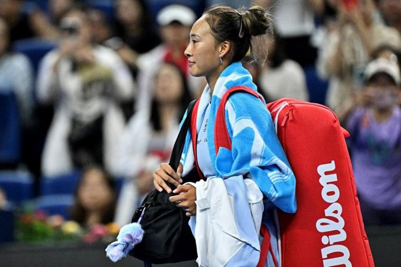 China's Zheng Qinwen leaves the court after retiring against Czech Republic's Linda Noskova during their women's singles match at the China Open tennis tournament in Beijing on September 29, 2025. Pedro PARDO / AFP