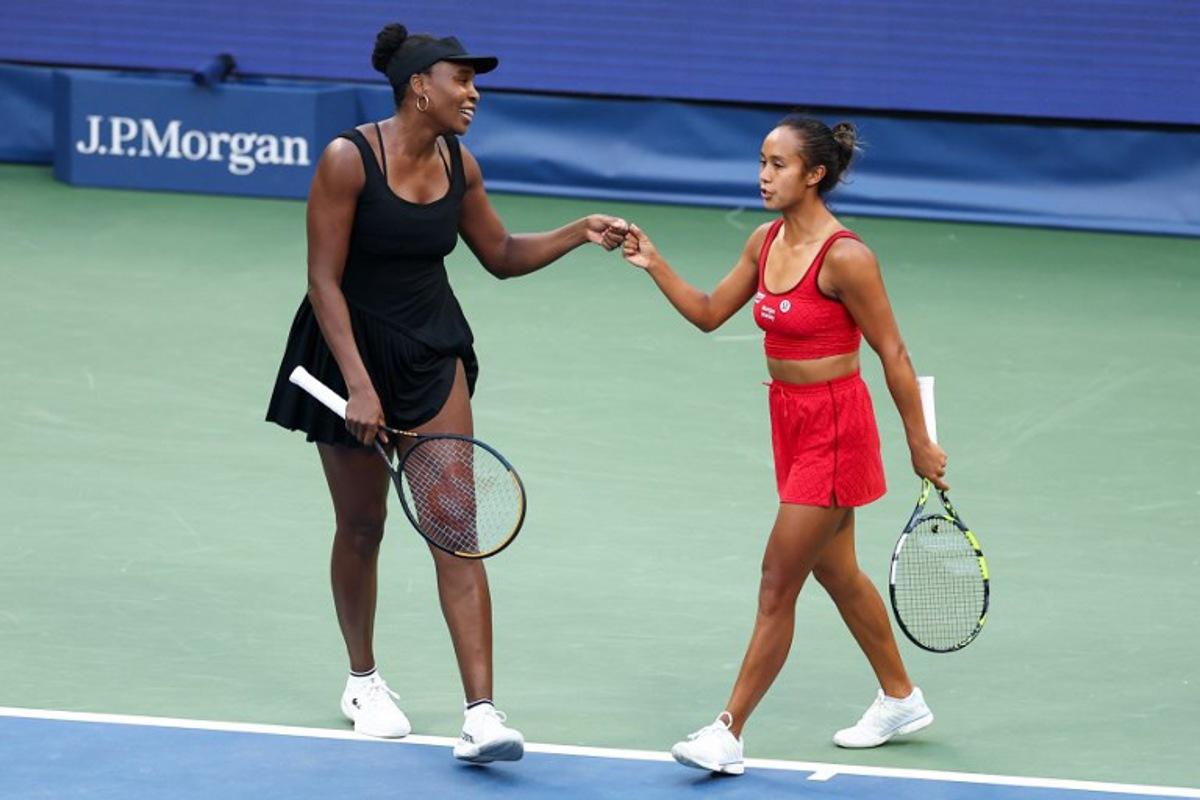 Canada's Leylah Fernandez (R) and USA's Venus Williams (L) celebrate a point during their women's doubles quarterfinal match against USA's Taylor Townsend and Czech Republic's Kateřina Siniaková at the US Open tennis tournament at the USTA Billie Jean King National Tennis Center in New York City on September 2, 2025. CHARLY TRIBALLEAU / AFP