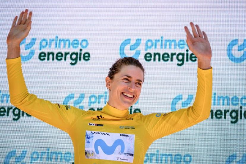 Switzerland's Marlen Reusser wearing the overall leader's yellow jersey celebrates on the podium after winning in the fourth stage, a 23,7 km time trial from Aarburg to Aarburg, at the Women's Tour of Switzerland (Tour de Suisse) cycling race in Aarburg, Switzerland, on June 20, 2026. Fabrice COFFRINI / AFP