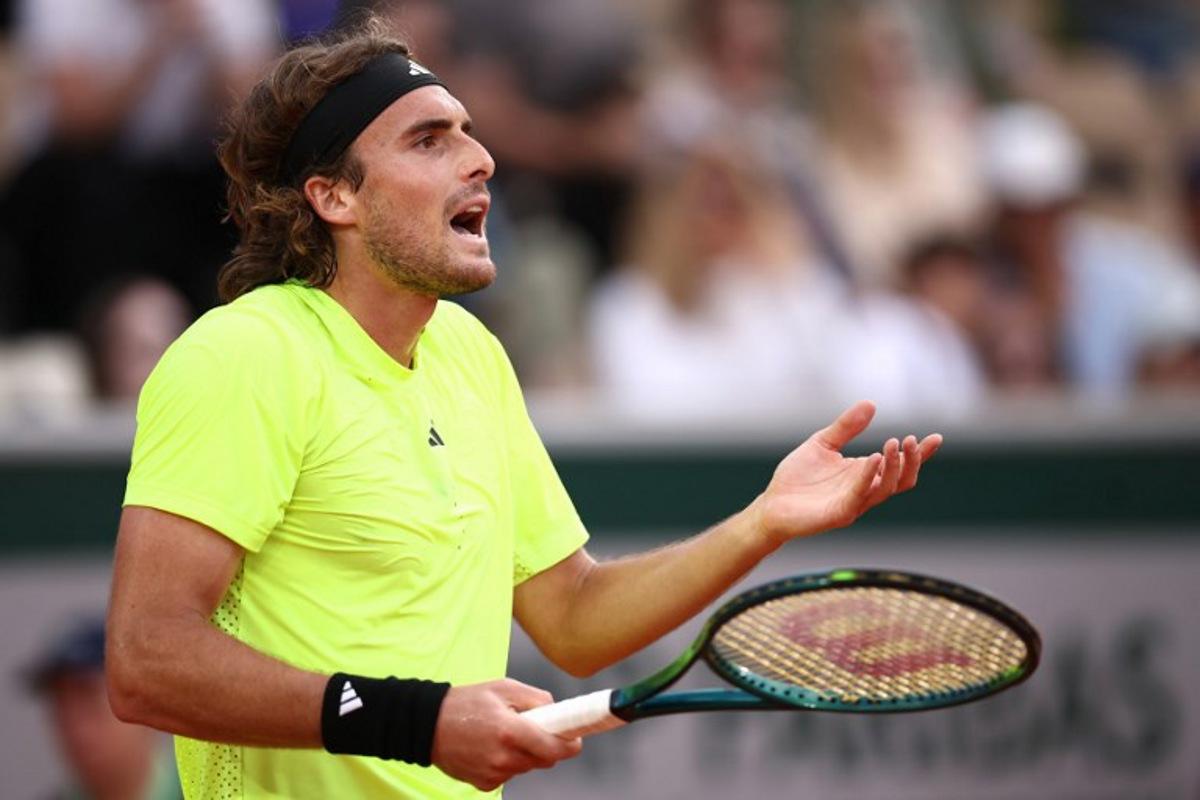 Greece's Stefanos Tsitsipas reacts during his men's singles match against Italy's Matteo Gigante on day 4 of the French Open tennis tournament on Court Simonne-Mathieu at the Roland-Garros Complex in Paris on May 28, 2025. Anne-Christine POUJOULAT / AFP