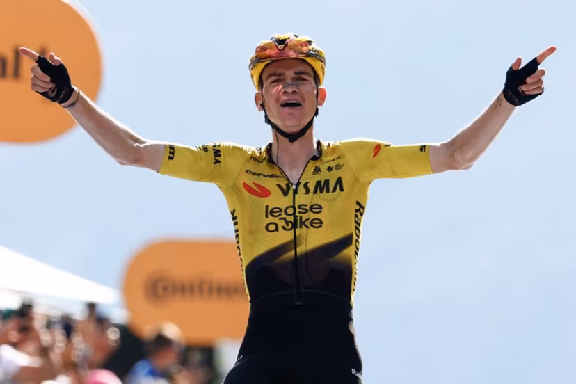 Team Visma Lease a Bike US rider Sepp Kuss celebrates as he crosses the finish line to win the 19th stage of the Giro d'Italia 2026 - Tour of Italy cycling race between Feltre and Alleghe, Italy, on May 29, 2026. Luca Bettini / AFP