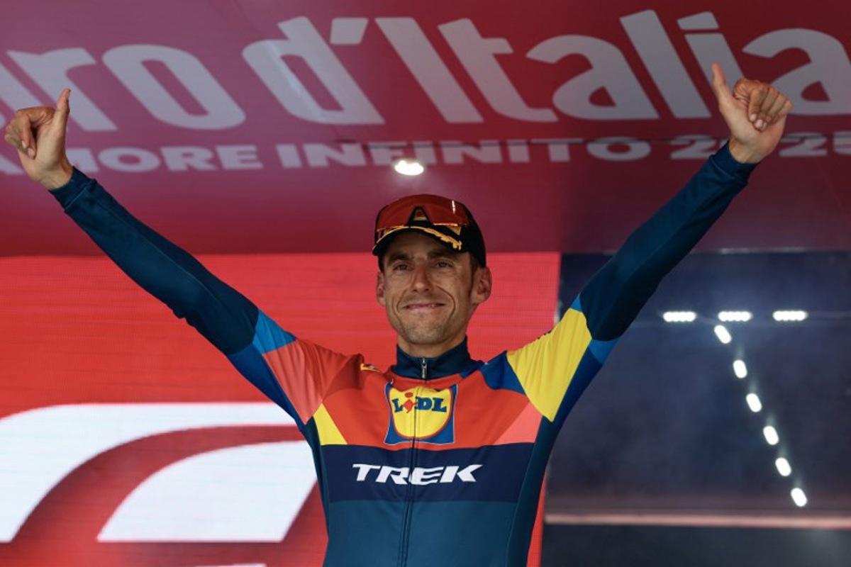 Lidl-Trek's Spanish rider Carlos Verona celebrates on the podium after victory in the 15th stage of the 108th Giro d'Italia cycling race of 219kms from Fiume Veneto to Asiago on May 25, 2025. Luca Bettini / AFP