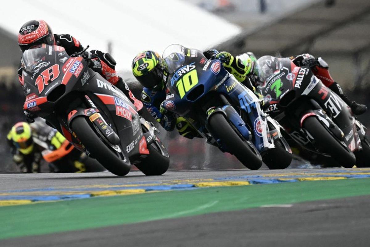 (from L) Liqui Moly Dynavolt Itact GP team's Spanish Moto2 rider Manuel Gonzalez, Italtrans Racing Team's Brazilian Moto2 rider Diogo Moreira, Fantic Racing Lino Sonego team's Belgian Moto2 rider Barry Baltus ride in the France Moto2 race at the Le Mans Circuit on May 11, 2025. LOIC VENANCE / AFP