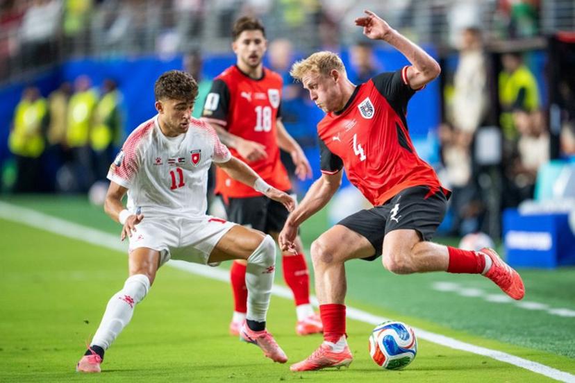 Austria's midfielder #04 Xaver Schlager and Jordan's forward #11 Odeh Fakhoury fight for the ball during the 2026 World Cup Group J football match between Austria and Jordan at the San Francisco Bay Area Stadium in Santa Clara, on June 16, 2026. GEORG HOCHMUTH / APA / AFP