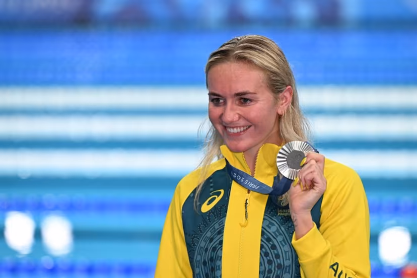 Silver medallist Australia's Ariarne Titmus celebrates during the podium ceremony of the women's 800m freestyle swimming event during the Paris 2024 Olympic Games at the Paris La Defense Arena in Nanterre, west of Paris, on August 3, 2024. Jonathan NACKSTRAND / AFP