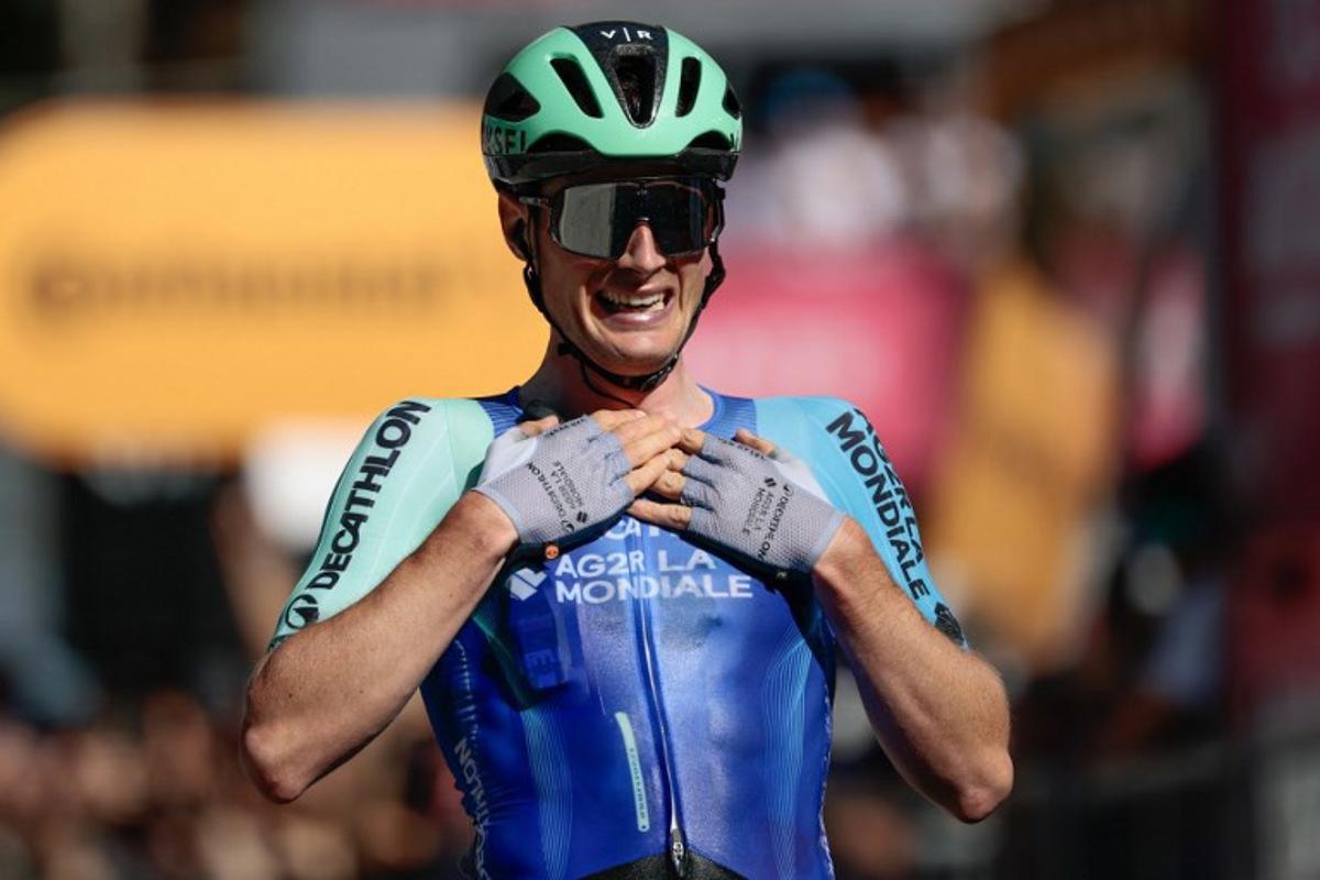 Decathlon AG2R La Mondiale Team's French rider Nicolas Prodhomme reacts after victory as he crosses the finish line of the 19th stage of the 108th Giro d'Italia cycling race of 166kms from Biella to Champoluc on May 30, 2025. Luca Bettini / AFP