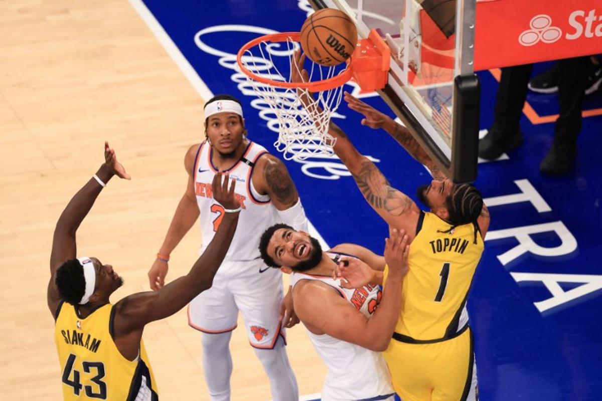 Knicks' center #32 Karl-Anthony Towns and Pacers' power forward #01 Obi Toppin fight for the ball during Game Five of the Eastern Conference Finals of the 2025 NBA Playoffs between the New York Knicks and the Indiana Pacers at Madison Square Garden in New York on May 29, 2025.  CHARLY TRIBALLEAU / AFP