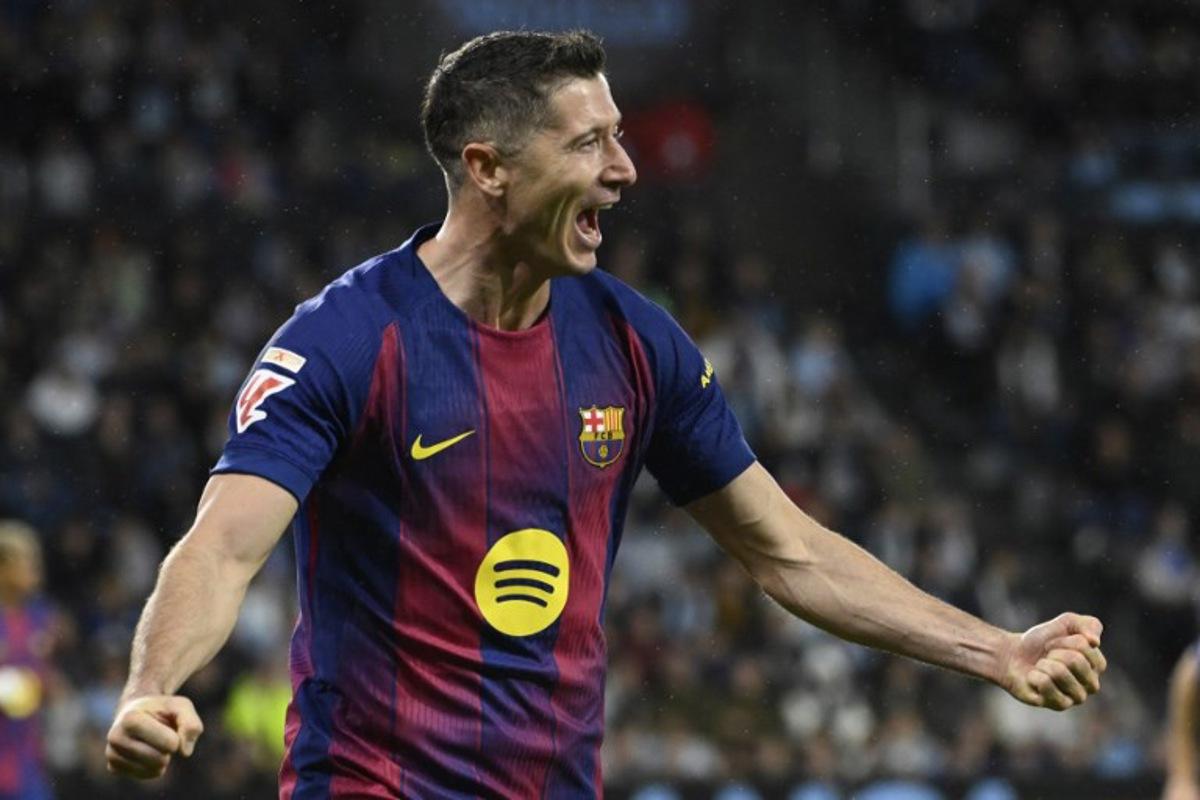 Barcelona's Polish forward #09 Robert Lewandowski celebrates his second goal during the Spanish league football match between RC Celta de Vigo and FC Barcelona at Balaidos Stadium in Vigo on November 9, 2025. Miguel RIOPA / AFP